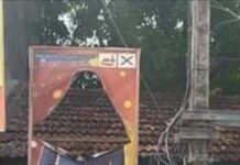 சேதமான கருணாவின் உருவ விளம்பர பதாகை